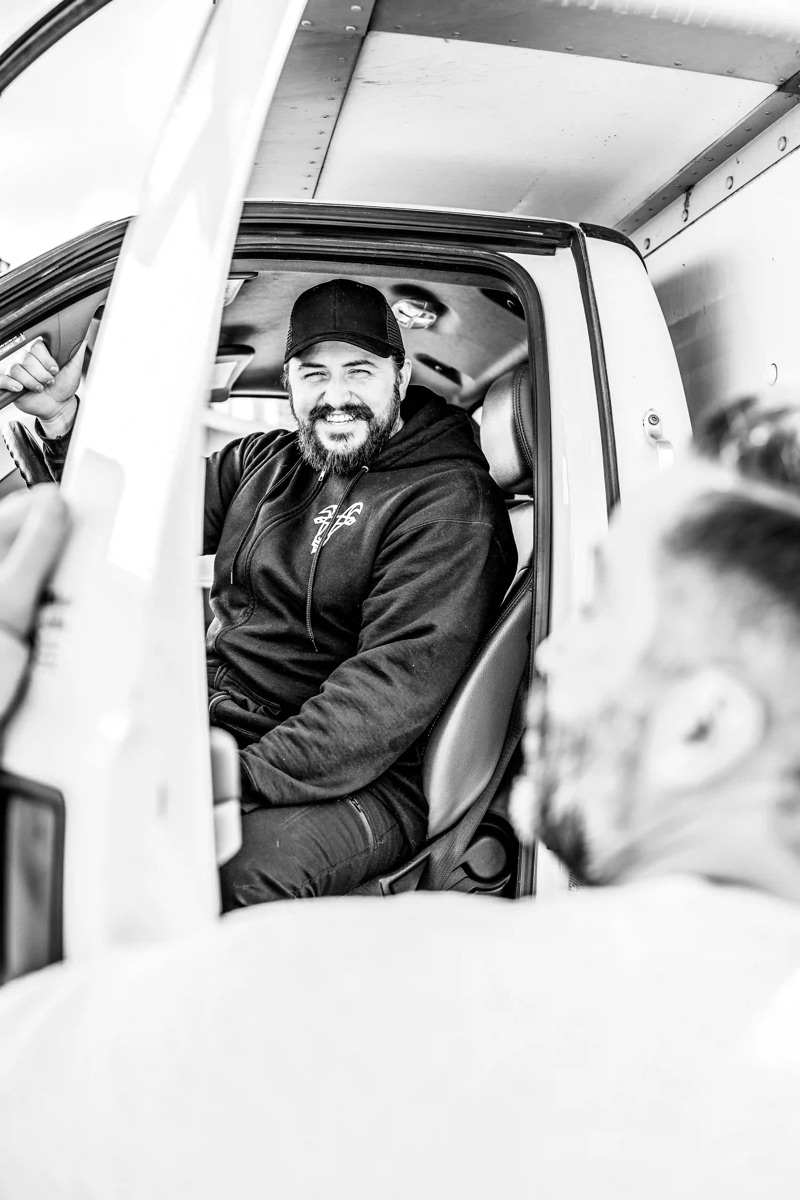 HaulCo driver in the cab — predictable moves on-schedule